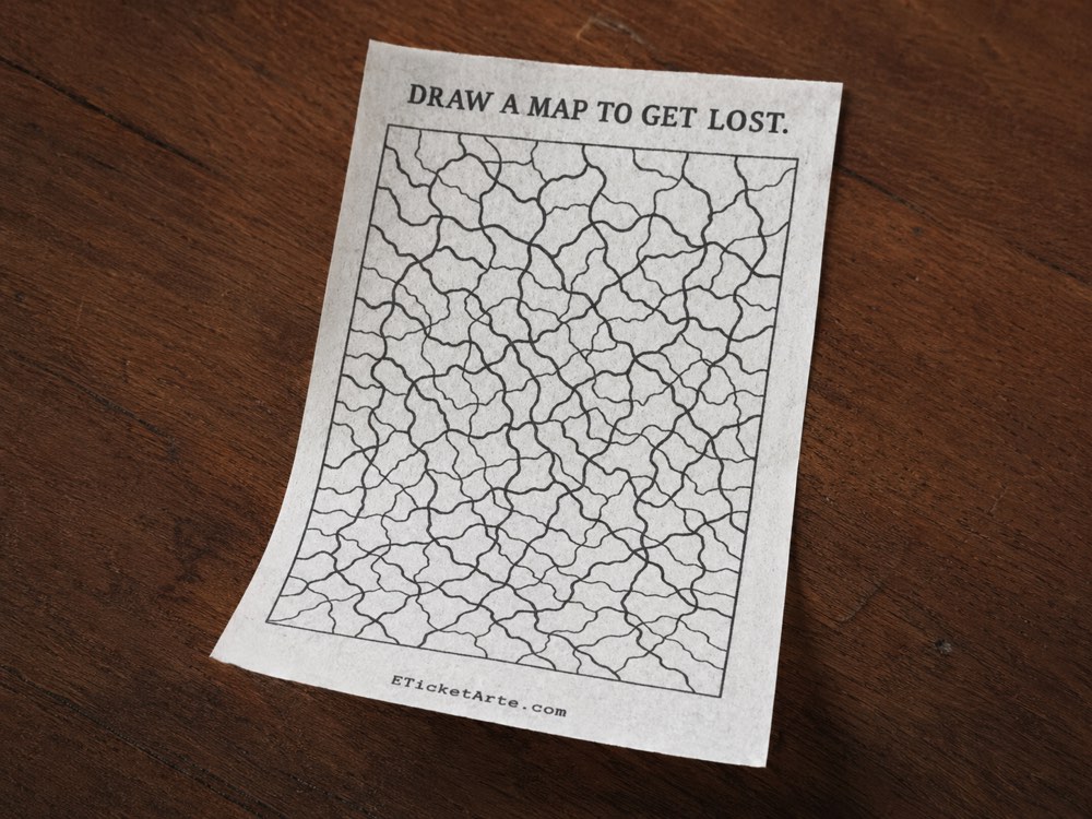 Ticket printed with the instruction: draw a map to get lost